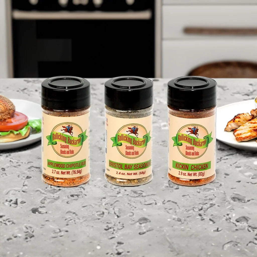 Applewood chipotle rub, bristol bay seasoning, and kicking chicken seasoning blends on a counter top