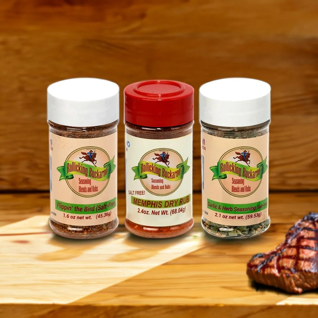flippin the bird salt free, memphis dry rub, and garlic and herb seasoning salt free seasoning blends next to each other on a wooden counter top