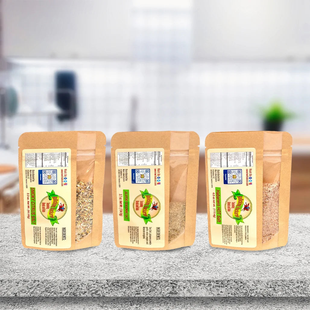 jalapeno seasoning salt, smoky citrus salt, and habanero hot salt seasoning blends next to each other on a kitchen counter top