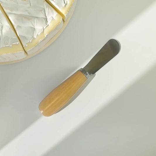 wooden spreader on a counter top