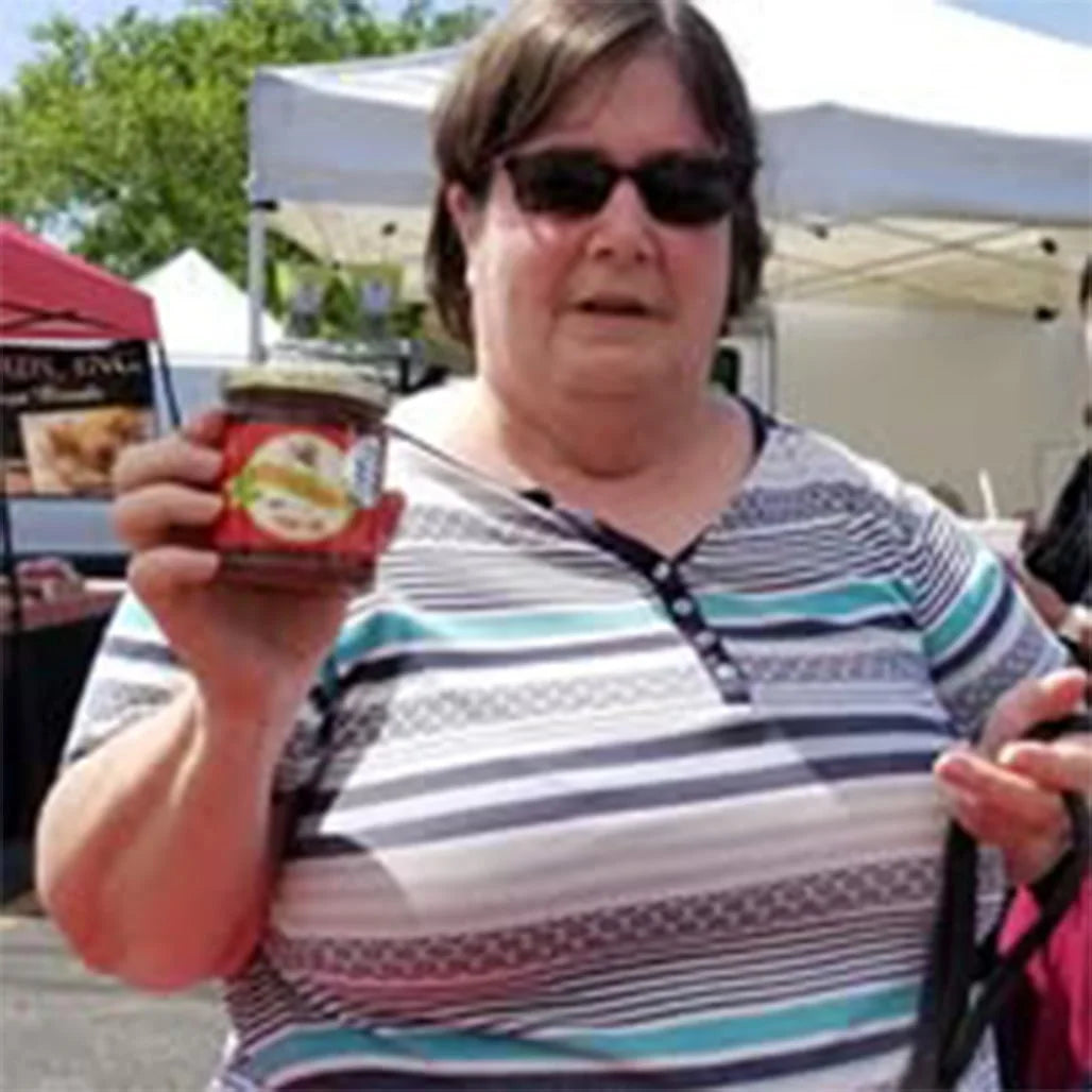 Rollicking Buckaroo customers holding jars of Rollicking Buckaroo Pepper Jam