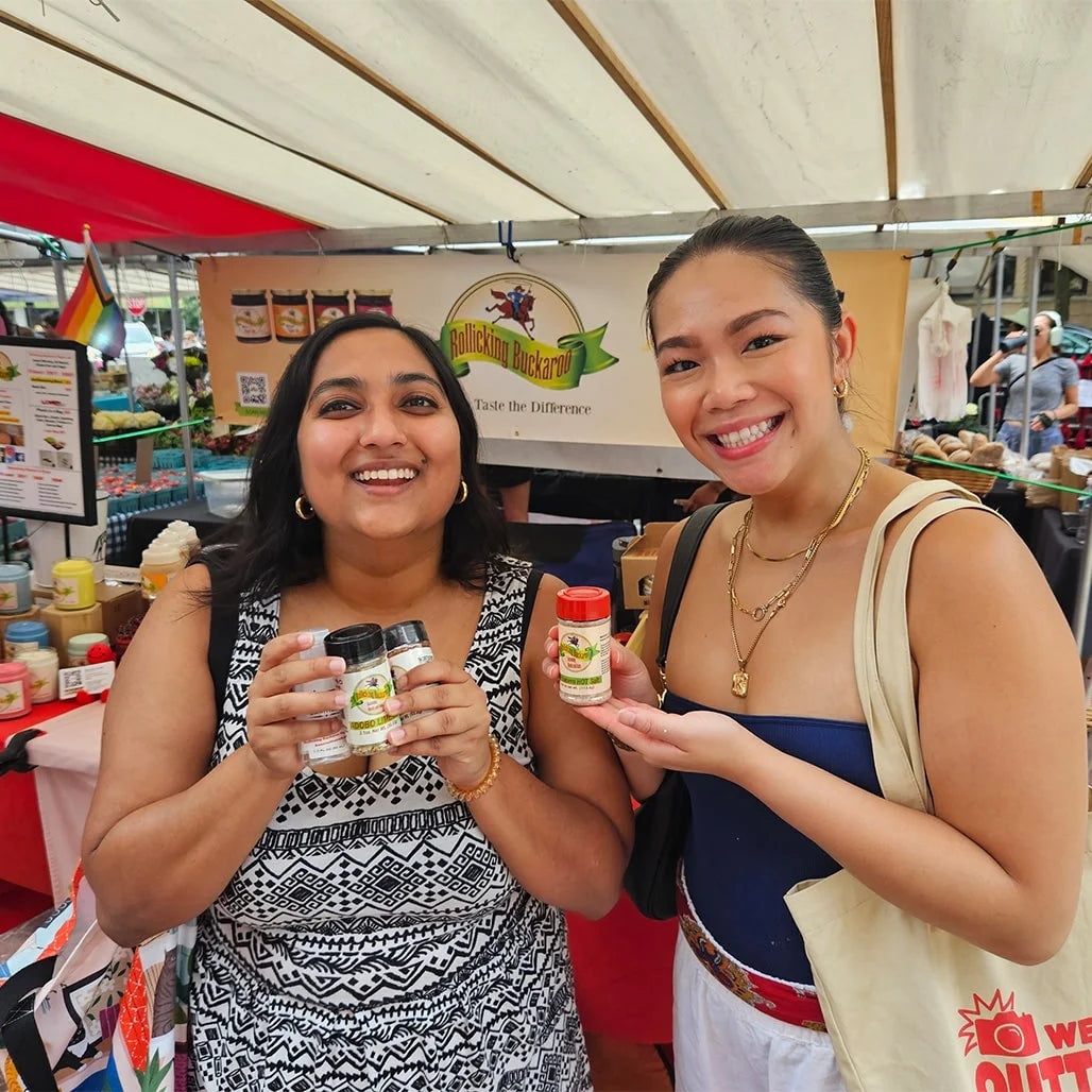 Rollicking Buckaroo customers holding jars of Rollicking Buckaroo Pepper Jam