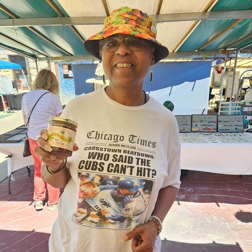 Rollicking Buckaroo customers holding jars of Rollicking Buckaroo Pepper Jam